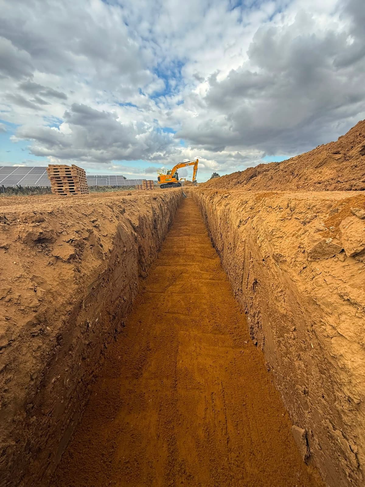 Civil engineering trench excavated through a renewable-energy site