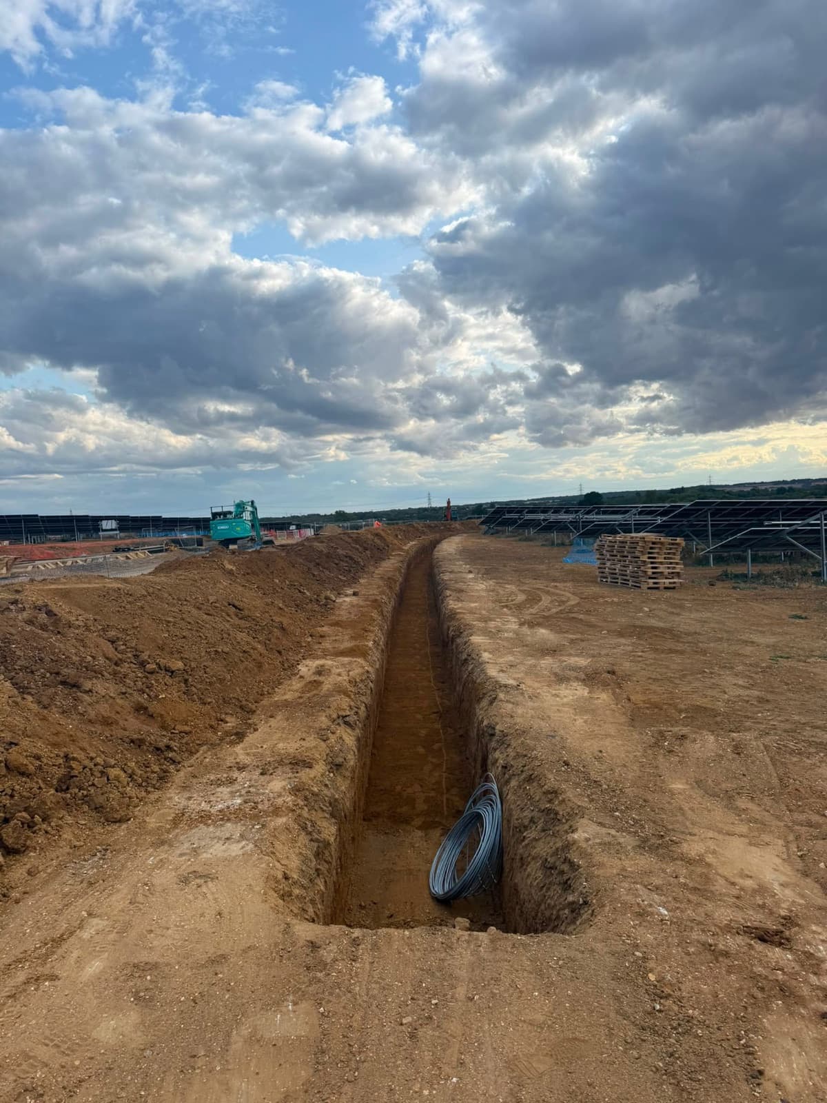 Prepared infrastructure trench route between solar arrays
